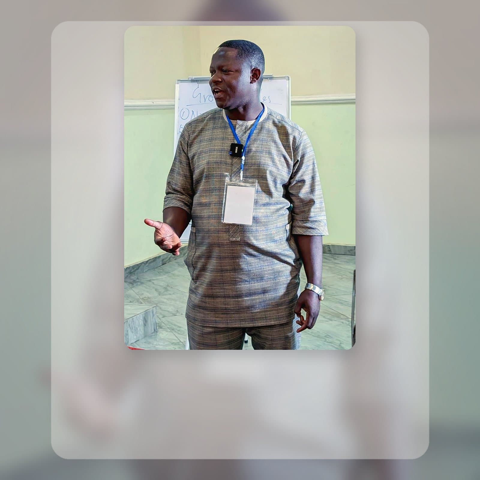 Vincent Dania speaking during a workshop session, styled for the PhD research page.